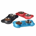 Black, red and blue bone-shaped silicone mats with steel bowls on a white background