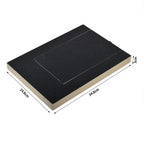 Black dog nail scratch board with a sandpaper top and light wood edge on a plain background