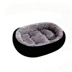 Round black dog bed with grey plush fleece inner, plain product shot on a white background