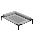 Grey raised dog bed with black metal tube legs, a black mesh centre panel and padded bolsters, on white