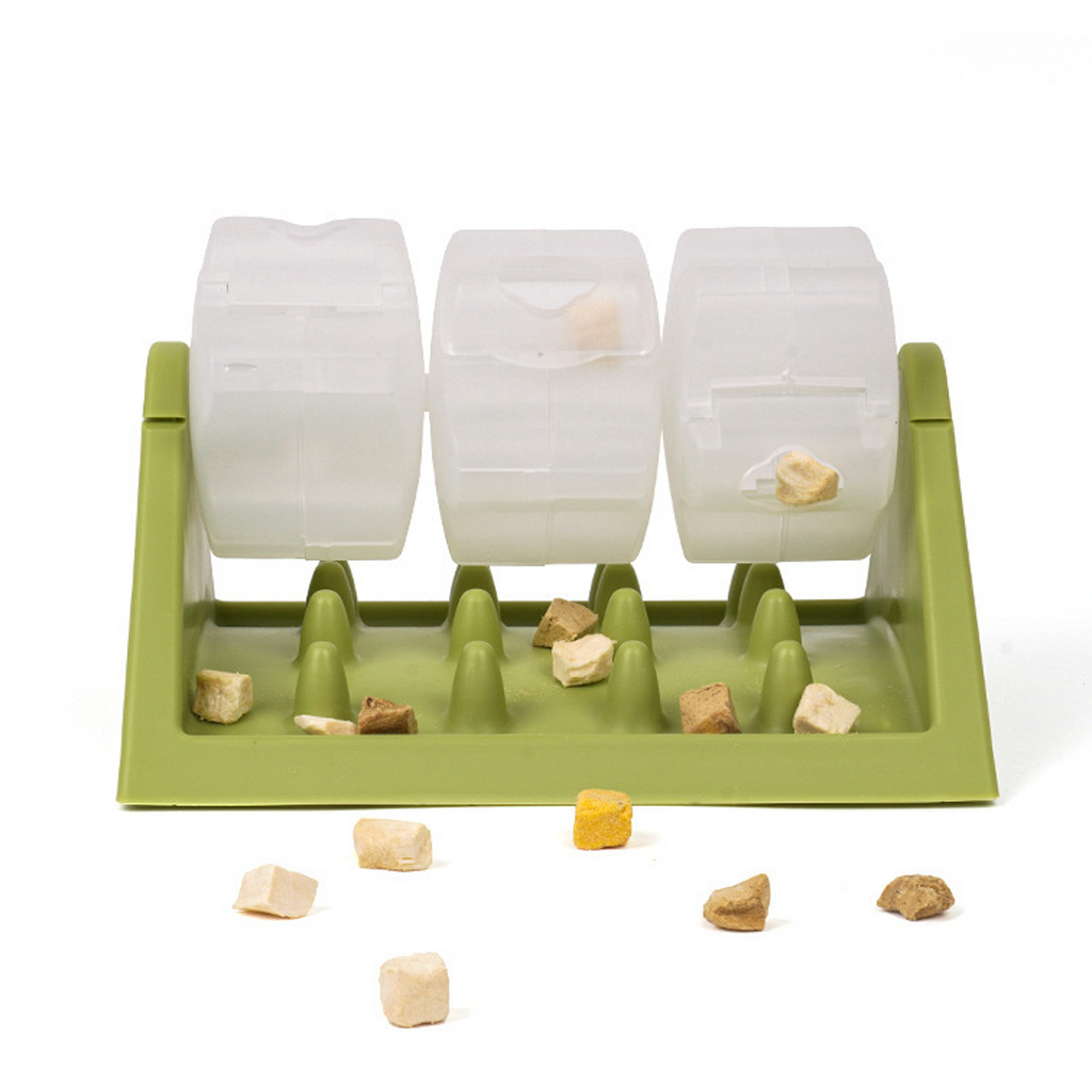 Green rotating puzzle slow feeder with a clear roller on a triangular plastic base